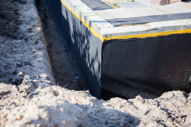 Professional Waterproofing technician working in Amesville, OH